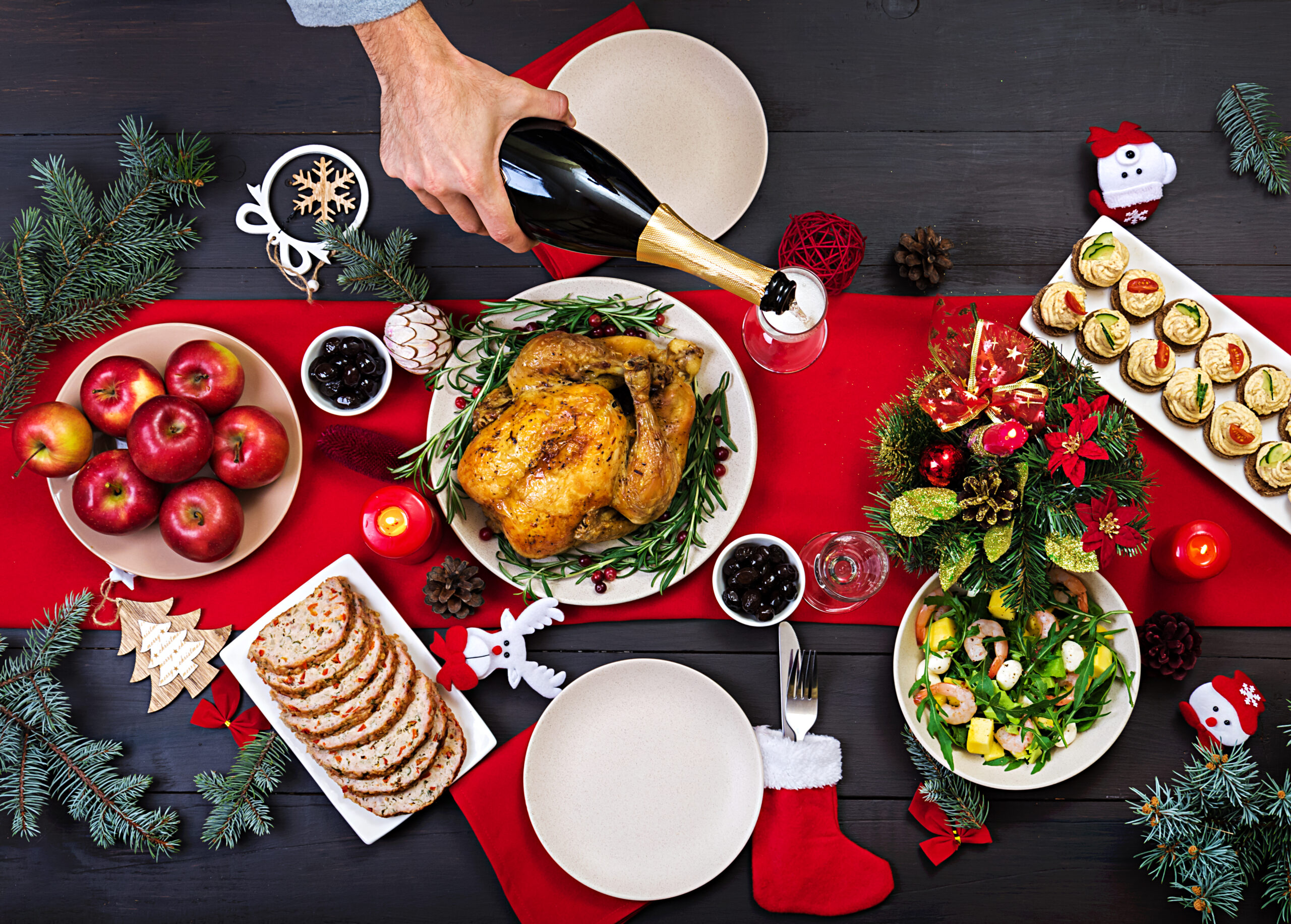 baked-turkey-christmas-dinner-the-christmas-table-is-served-with-turkey-decorated-with-bright-tinsel-and-candles-fried-chicken-table-family-dinner-top-view